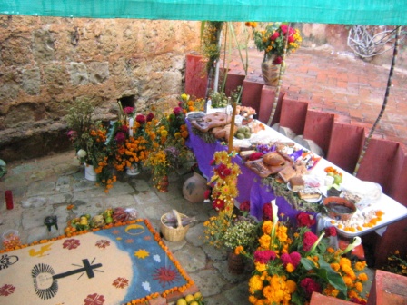 Días de los Muertos or Day of the Dead ofrenda and sand painting.