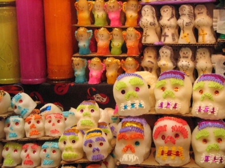 Colorful calveras(skulls) and other shapes made from sugar for sale at market.